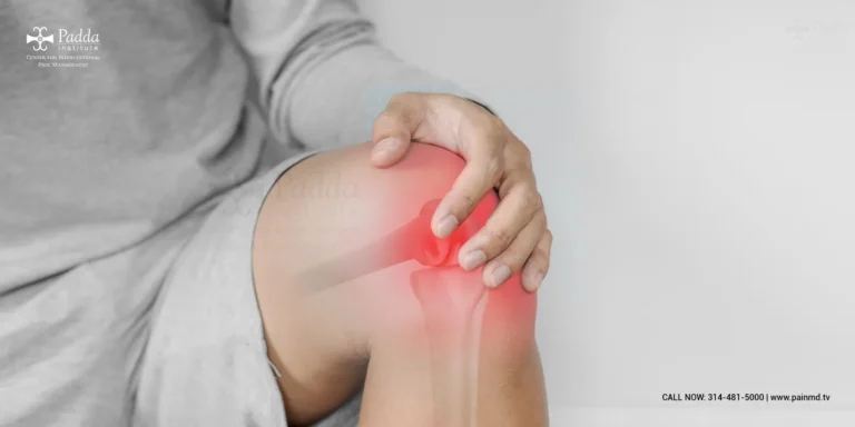 Person holding a shoulder with the joint highlighted in red