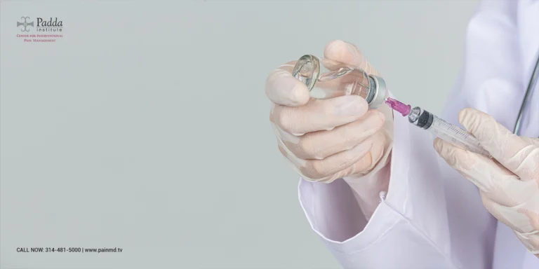 Gloved hands drawing medication into a syringe