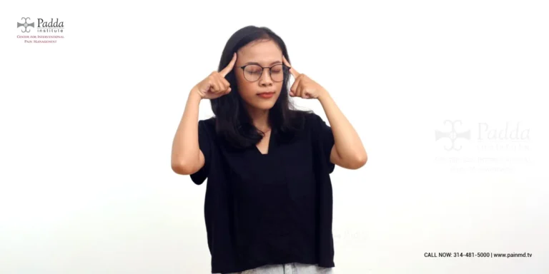 Woman pressing her fingers into her ears to block out sound