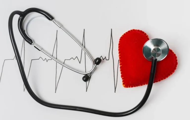 Stethoscope arranged to form an ECG trace leading to a red fabric heart
