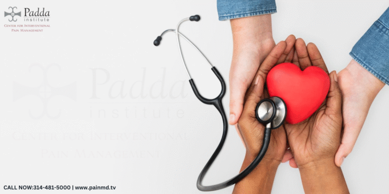Hands cradling a red heart beside a stethoscope