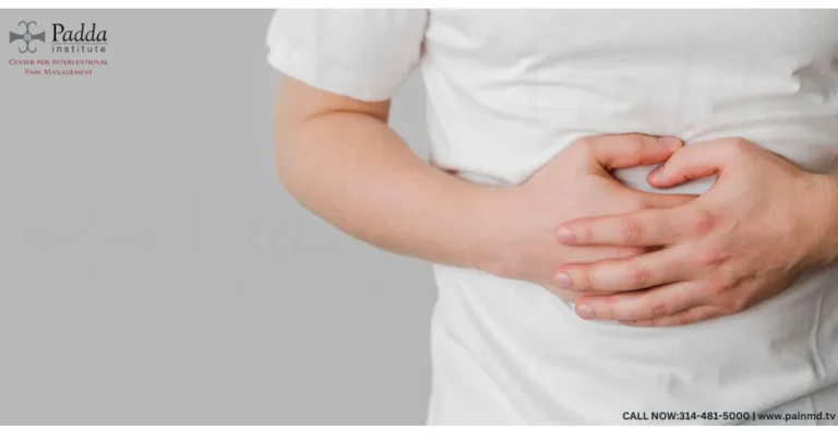Person holding their abdomen with both hands