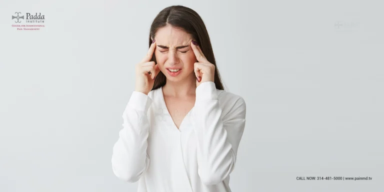 Woman pressing her fingers to her temples