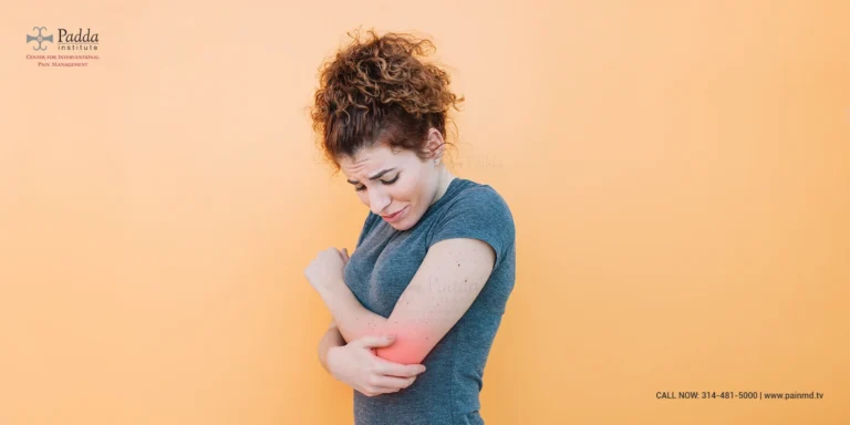Woman holding her elbow with the joint highlighted in red