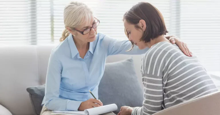 Two women sitting together during a counselling session