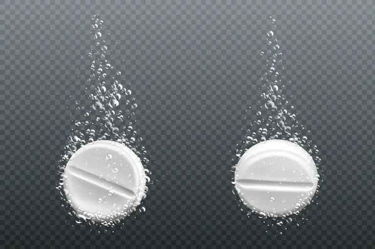 Two effervescent tablets dissolving in water