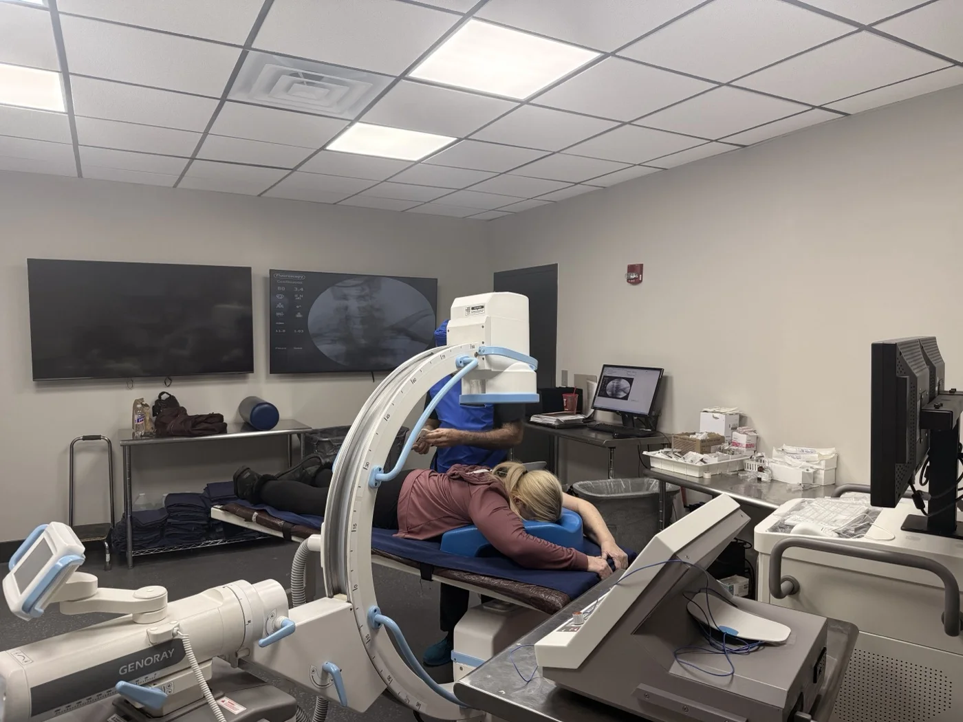 Fluoroscopic image displayed on the monitor while an image-guided injection is performed at Padda Institute, St. Louis