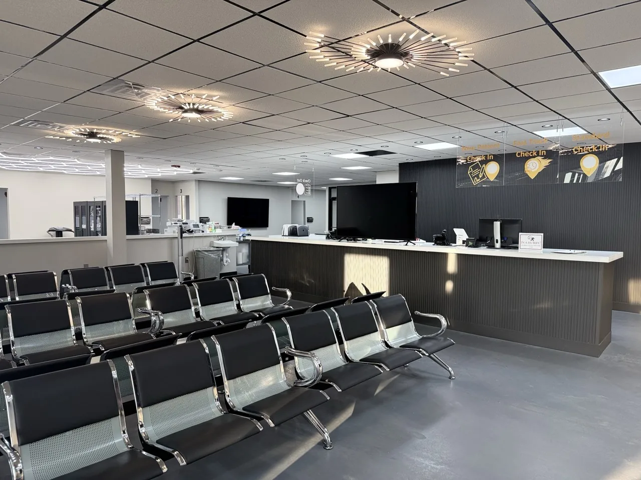 Patient waiting room and check-in desk at Padda Institute Center for Interventional Pain Management, 4477 Woodson Rd, St. Louis, MO